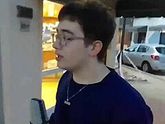 Fat guy bends over to insert microphone in ass