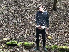 the horny cute european boy steps outdoors in snowy weather, stroking his big dick with intense focus until climax.